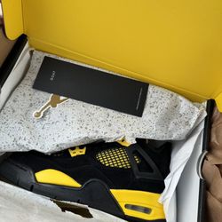 Black And Yellow Jordan 4s