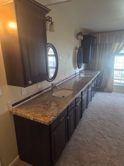 Free vanity, sink, cabinets, and mirrors