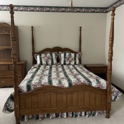 Vintage bedroom set – poster bed, dresser, freestanding mirror, and nightstand.