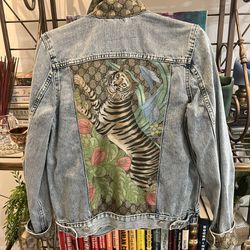Collector’s item: denim jacket featuring vintage silk Gucci scarf accents. 