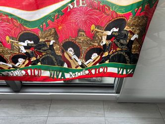 Reversible Mexican mariachi scene tablecloth (93” x 53”) – white, green & red with Aztec-inspired architecture design