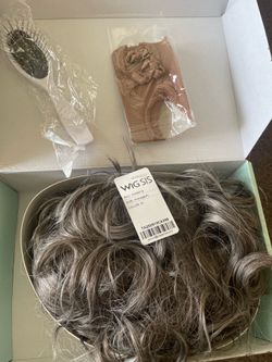 WIG SIS, specifically the model in SKU WW8316.The item is a curly, messy bun extension designed for easy styling and volumizing.The color is labeled a