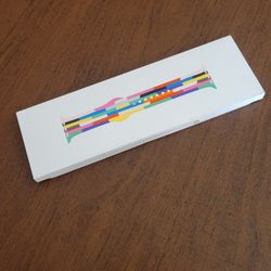 Apple Watch Sport Band 46mm M/L Pride Edition MDWG4AM/A New, open box. 
Never taken out of the box, still attached to the box.
Please see photos for d