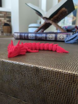 Red articulated 3d printed water dragon