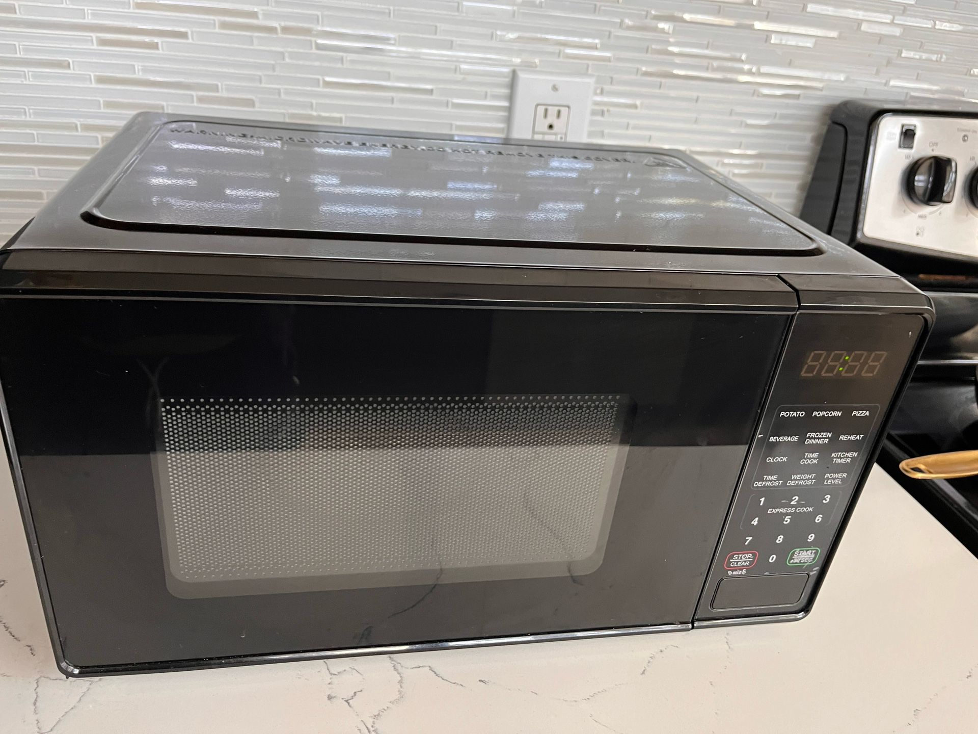 0.2 Cubic Feet 700 Watts Black Counter Top Microwave
