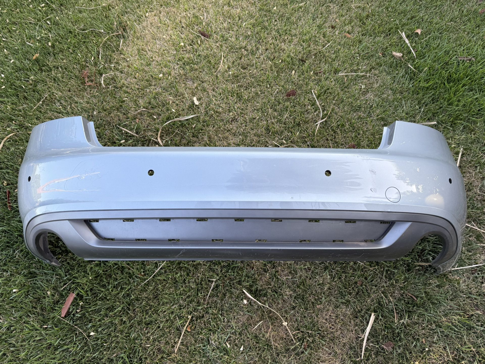 2009 Audi A5 (B8) rear bumper in Monza Silver, with parking sensors