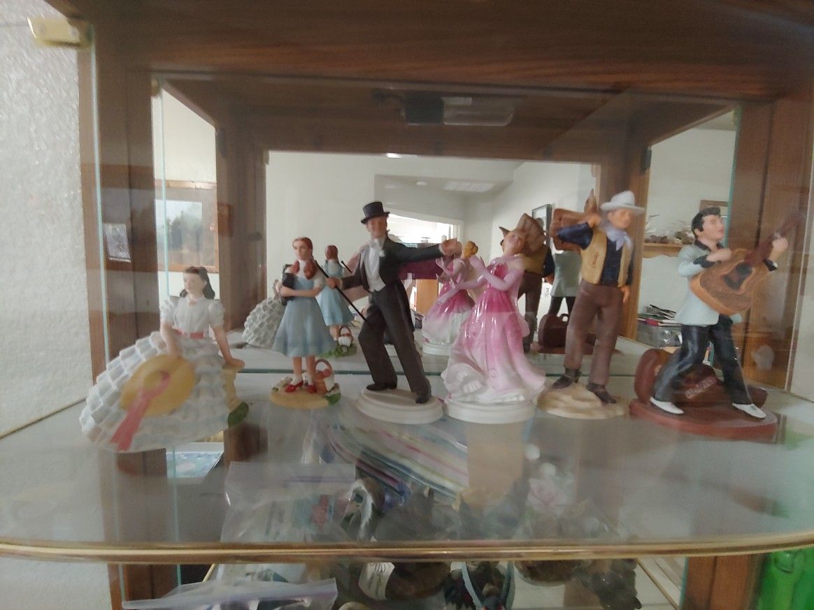 Avon images of Hollywood figurines Fred astaire , ginger Rogers, John Wayne, Judy Garland, Scarlett Hoare Elvis Presley .