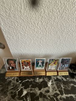 5 of the ( This object is an acrylic memorabilia display stand with a wooden base )