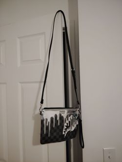 Sprayground clutch crossbody