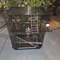 Bird cage with accessories in good condition