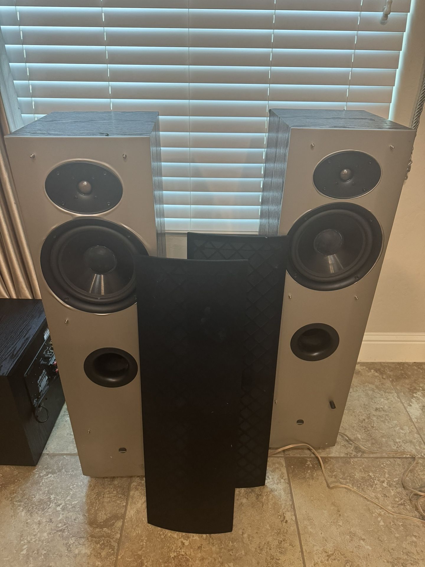 Two towers, center channel and 12 inch Polk audio subwoofer