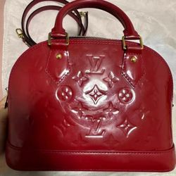 Louis Vuitton leather shell bag in red color