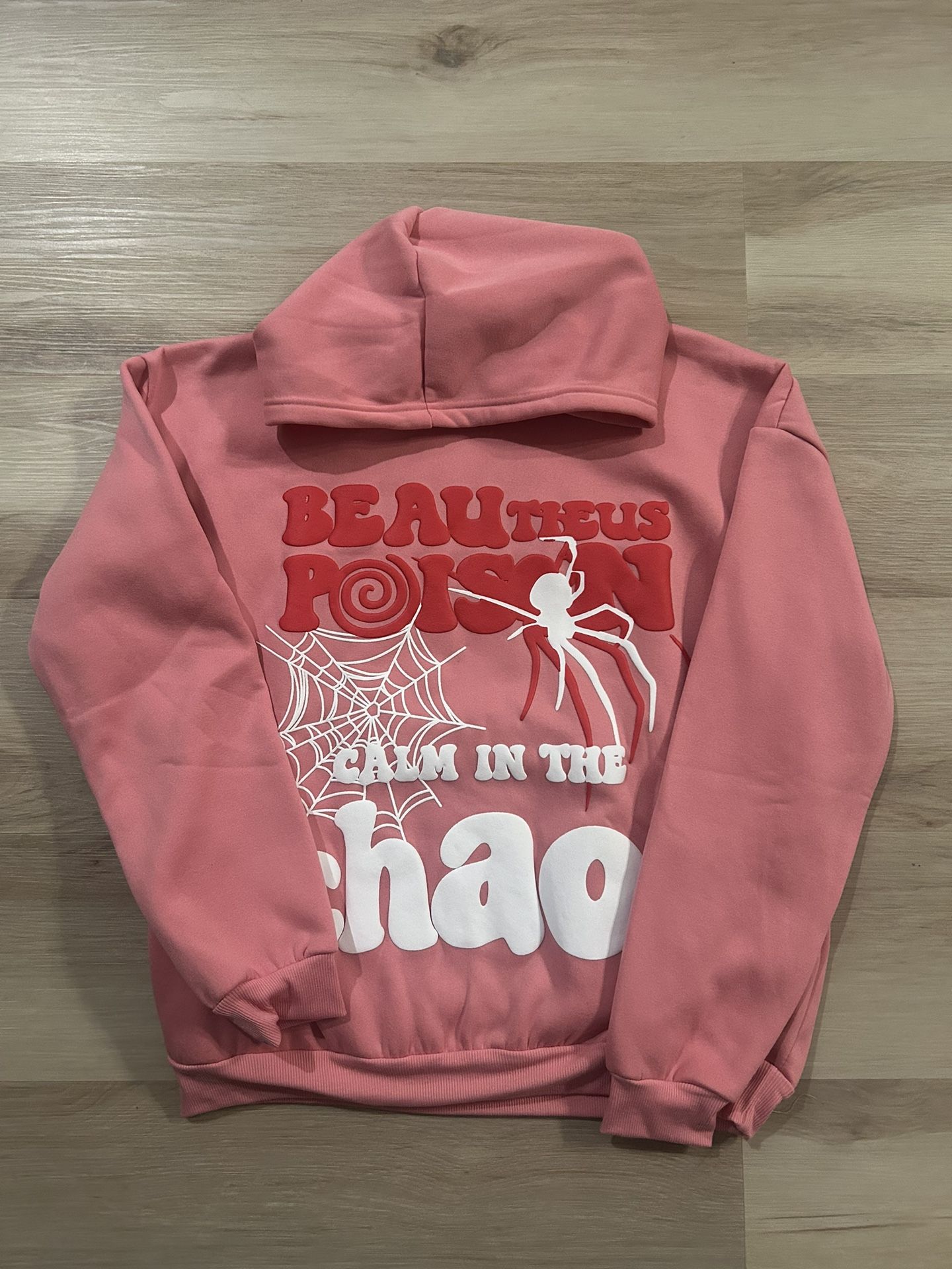 Pink and white calm in the chaos spider Poison pullover hoodie