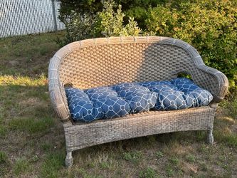Wicker couch with cushion