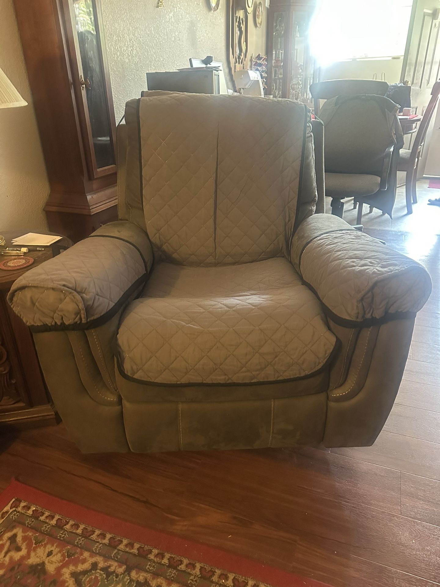 Gray recliner with white stitching