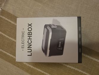 New electric lunchbox in a black and grey color scheme. This portable food heater has a digital display panel with temperature and timer controls. The