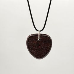 Stardust IV Orgonite Pendant, Provides EMF Protection, And  Balance. 

Contains: 
Red jasper, black obsidian, metal, and resin. 

"Embark on a journey