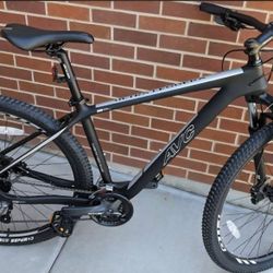 This is an AVC Ultra Leggera mountain bike featuring a lightweight carbon fiber frame. 