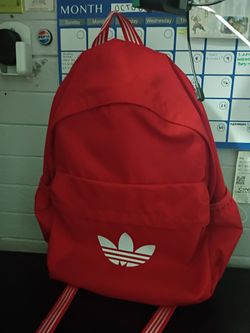 Red Adidas backpack.