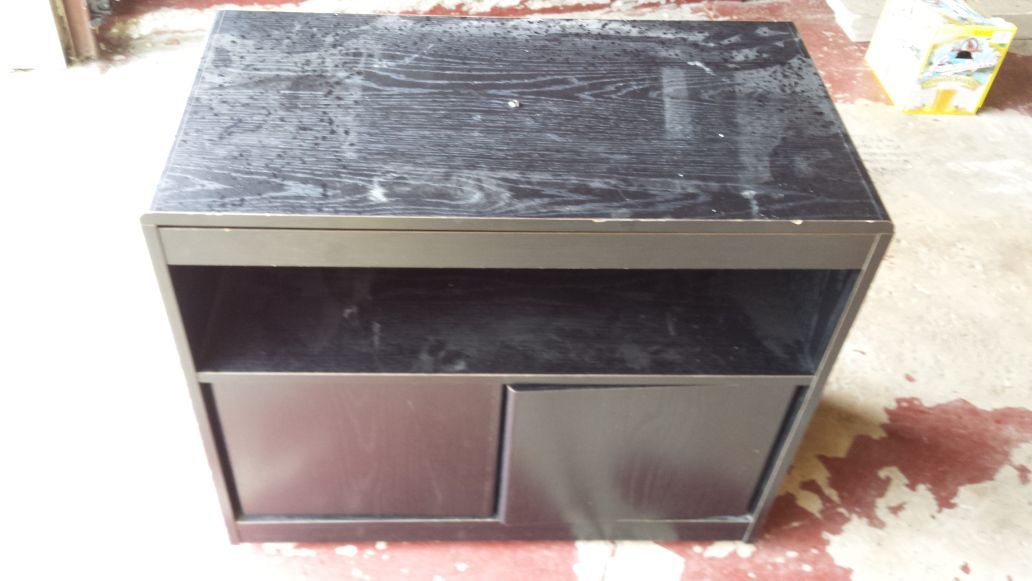 Black stained wood swivel TV stand on wheels