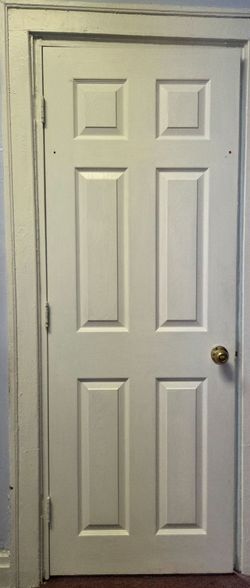 White 6-Panel Interior Door with Brass Knob