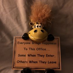 Humorous Giraffe Holding Office Sign 