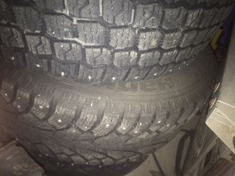 Studded snow tires 205/60/R15 on black rims. NEED GONE!