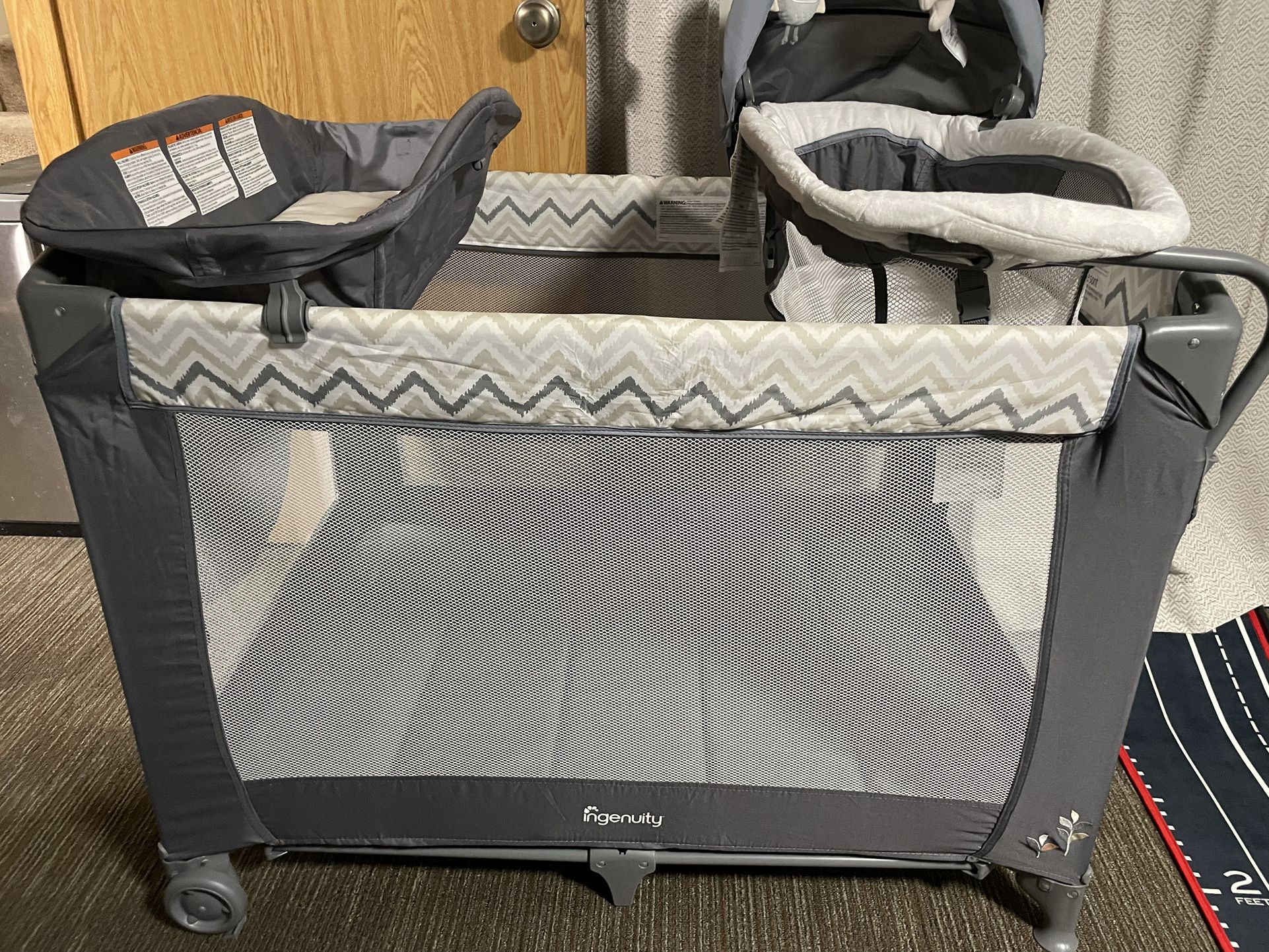 Ingenuity Smart and Simple Portable Playard with Changing Table, Play Pen, Bassinet for Infant & Storage Pockets, Easy to Fold
