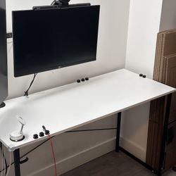 Computer desk with cable clips and Magsafe phone stand