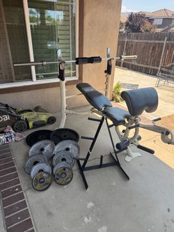 Bench press with 7ft 40lbs bar plus 245lbs of Olympic weights and weight tree