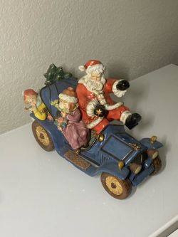 Vintage Porcelain Santa on Whees figurine