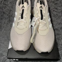 Size 9 men’s brand new unworn Adidas shoes with tags and box.