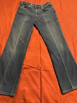 Three Pairs Of Levi Strauss Jeans, And One Pair Of Wrestler Jeans
