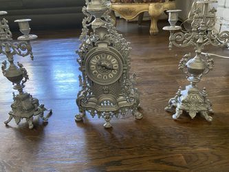 Silver antigue replica clock and candelabras