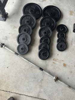 131.7 LBS Of 1” Weight Plates With Long Bar 
