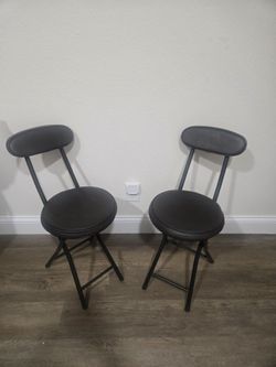 TWO FOLDING CHAIRS