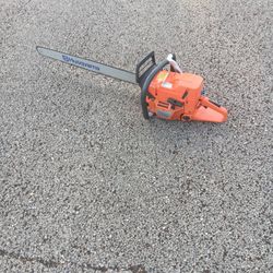 Husqvarna chain saw with 32" bar model 372XP has rap around handle used 2 times runs great 