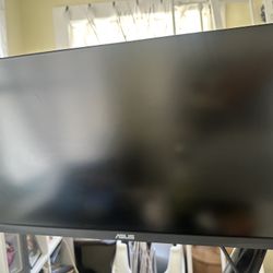 Asus tuf gaming monitor 23.8 in 1080p 165hz and a adjustable monitor mount