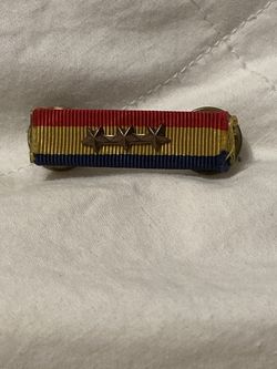 Navy & Marine Corps Overseas Service Ribbon with three bronze service stars indicating a fourth award