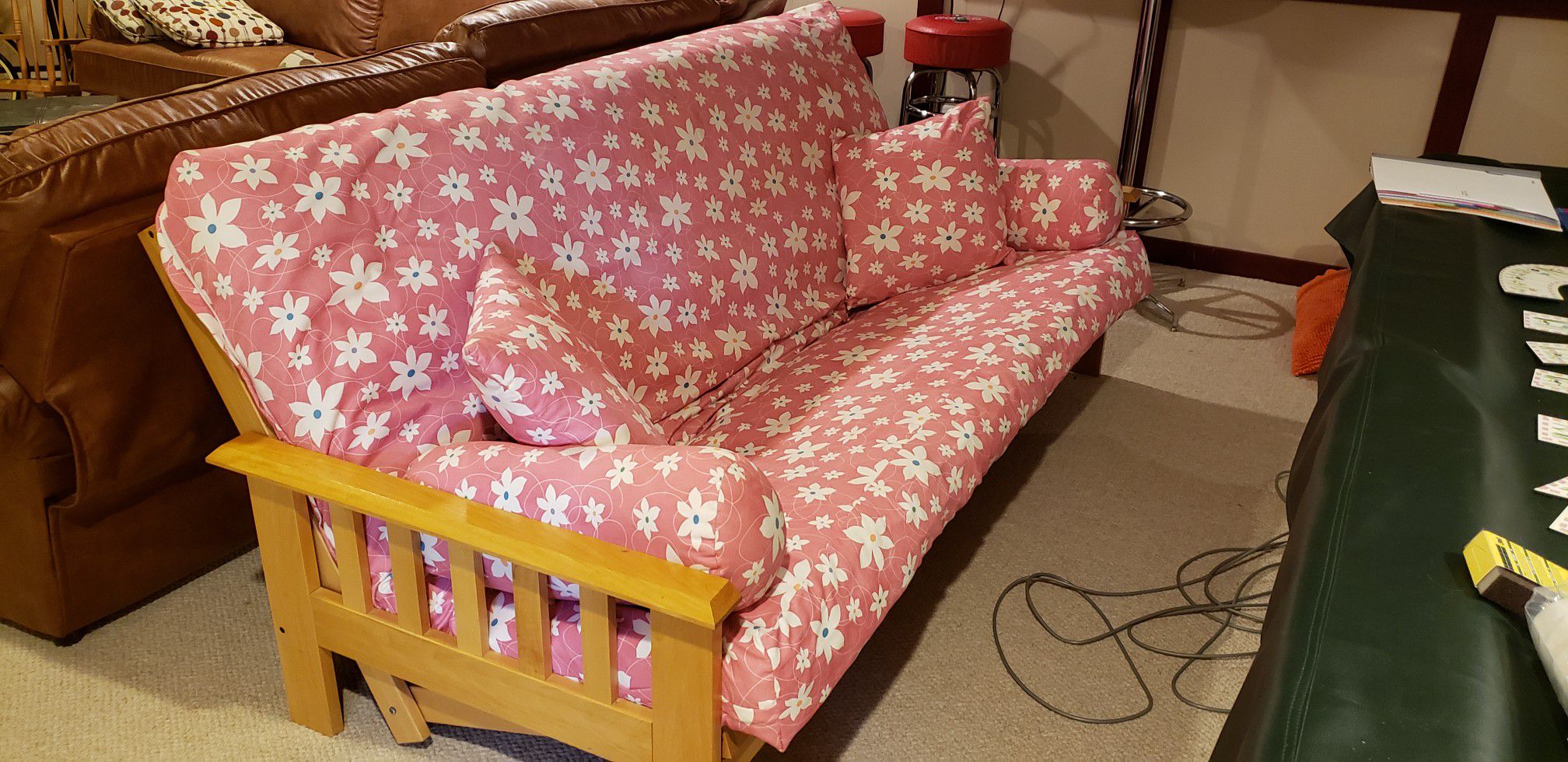 Pink with flowers futon.Cover is like new.