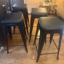 Four 27” Bar Stools Black Metal And Black Padded Seat. $79 Each At Fred Meyer 