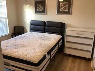 For sale. A SLIGHTLY USED BED WITH VEGAN LEATHER HEADBOARD