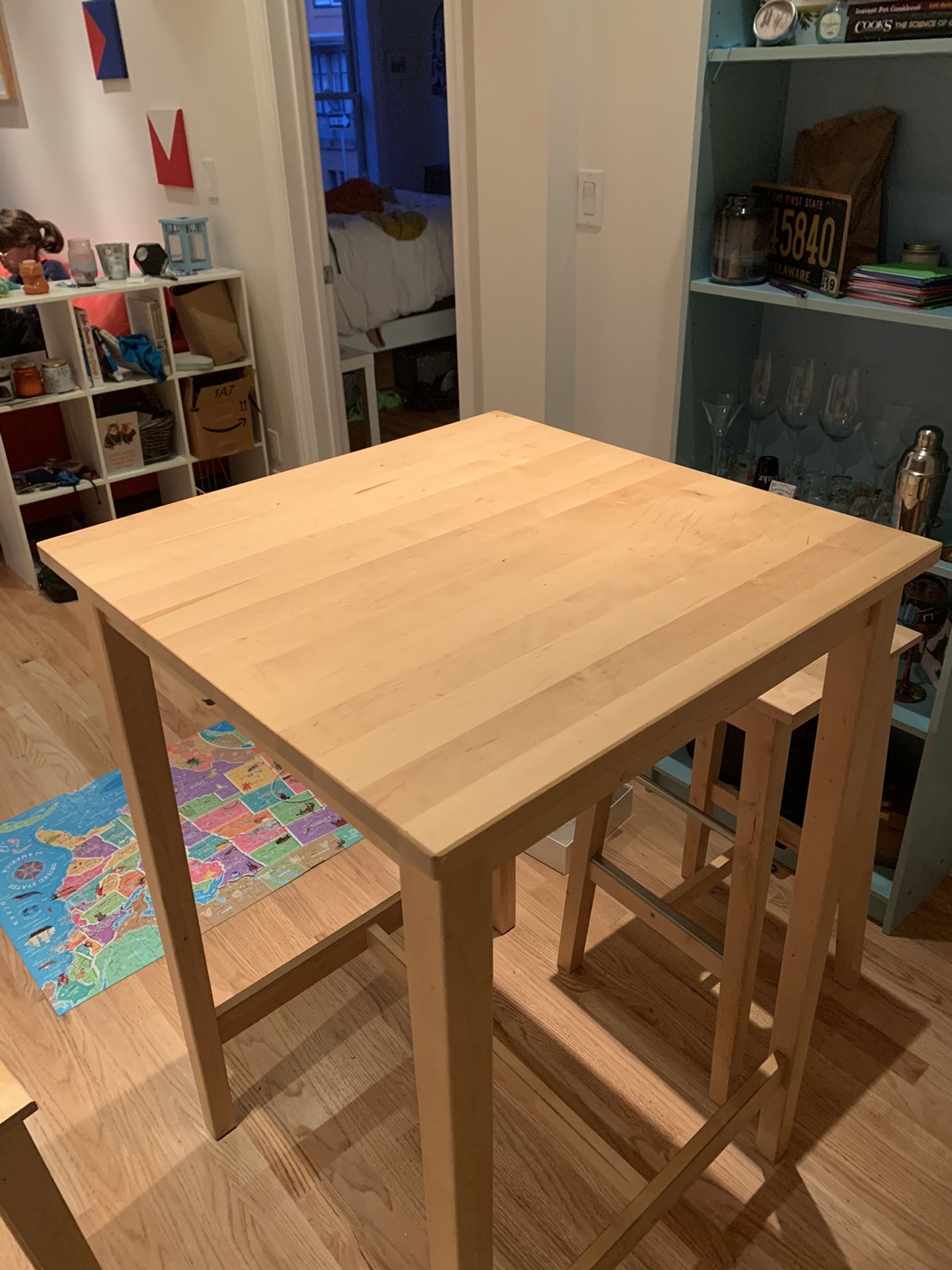 Light wood, bar height small table with two stools