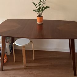 Solid Wood Dining Table: 59" x 35" x 30" — Shows minor signs of use.