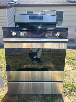 Amana 30" freestanding gas range in stainless steel and black. Model AGR6303MFS0