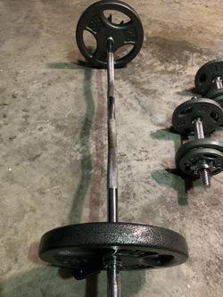 50 lb barbell curl bar with 25 pound weights plates gym equipment
