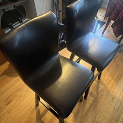 Two Leather Swivel Bar Stools