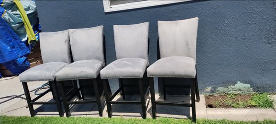 LIKE NEW  4 CUSHIONED  GREY CHAIRS