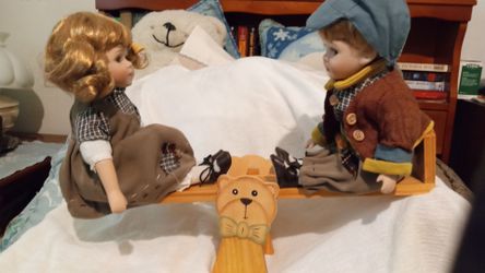 Porcelain Doll Pair on Wooden Seesaw