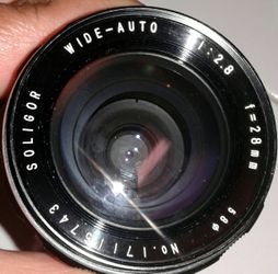 Soligor wide auto, 28mm lens with cosmetic flaw pictured and labeled